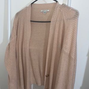 can be worn as a cardigan or sweater
